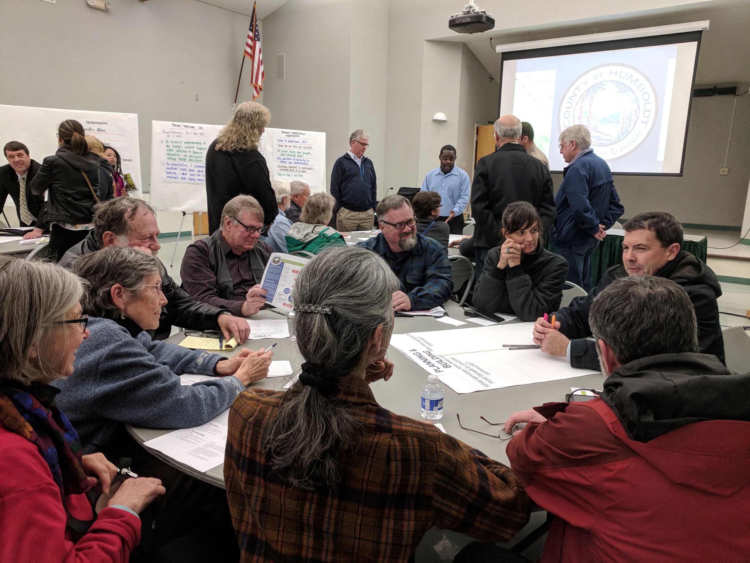 Group of citizens sitting around a table in McKinleyville