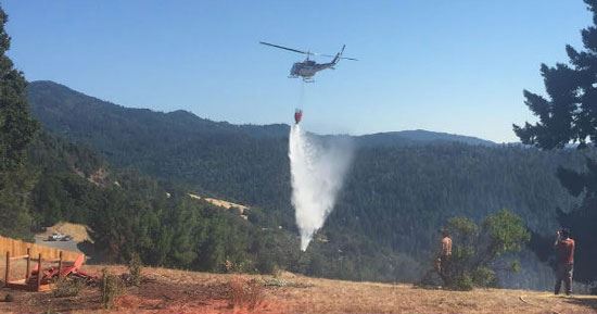 helicopter dropping water