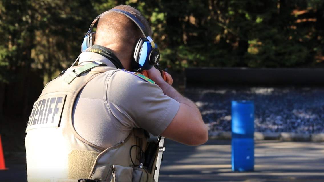 Deputy aims less lethal shotgun