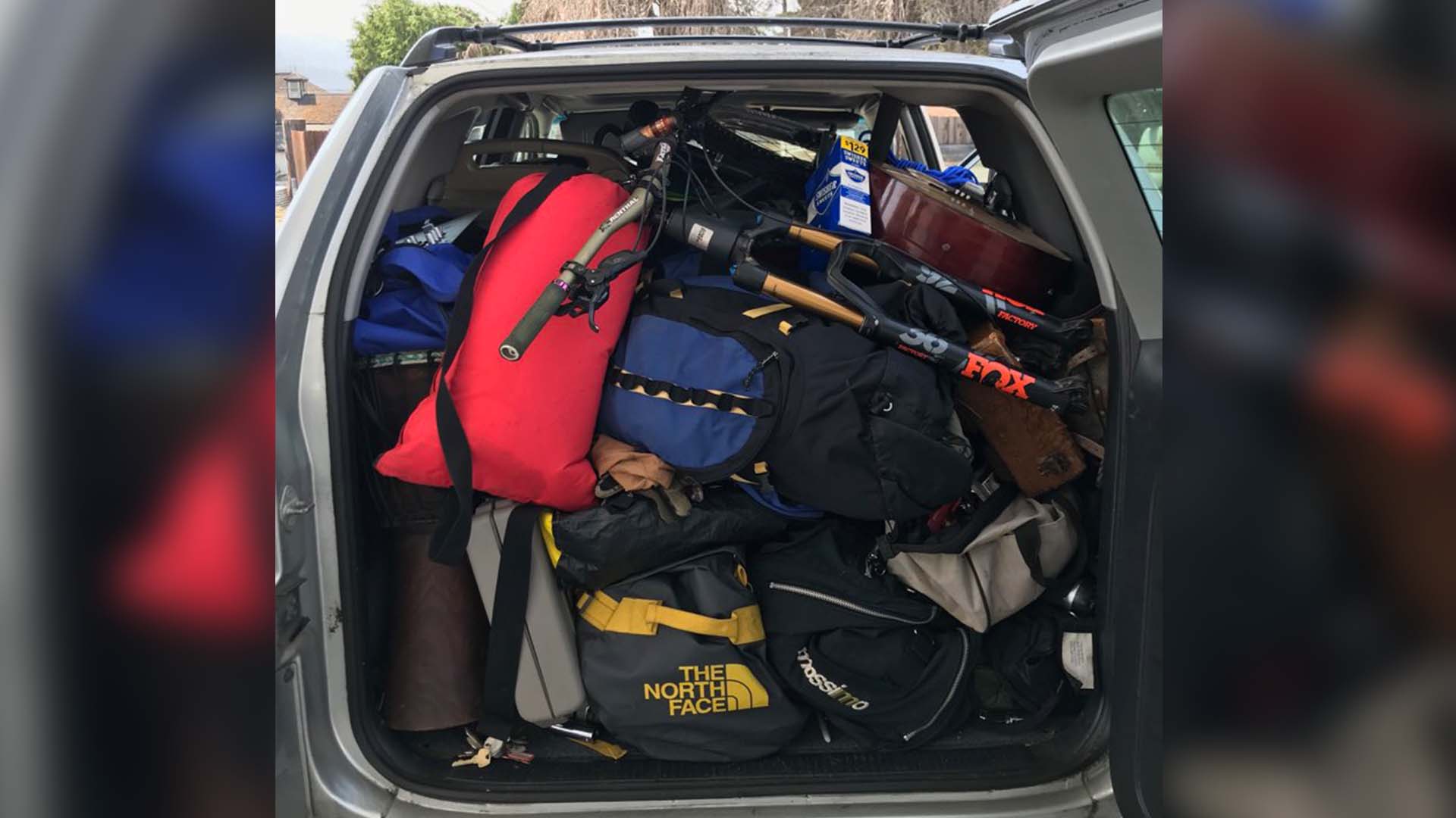 The trunk of a vehicle stuffed full of suspect stolen items