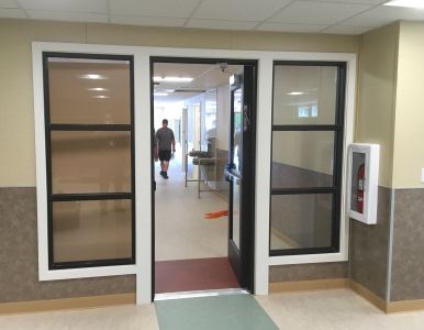 The door from the library to the hallway, drinking fountains, restrooms, & entrance.
