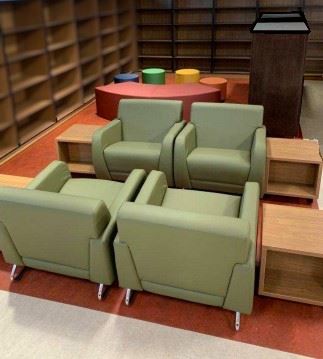 Comfortable padded armchairs and colorful children's furniture in playful shapes.