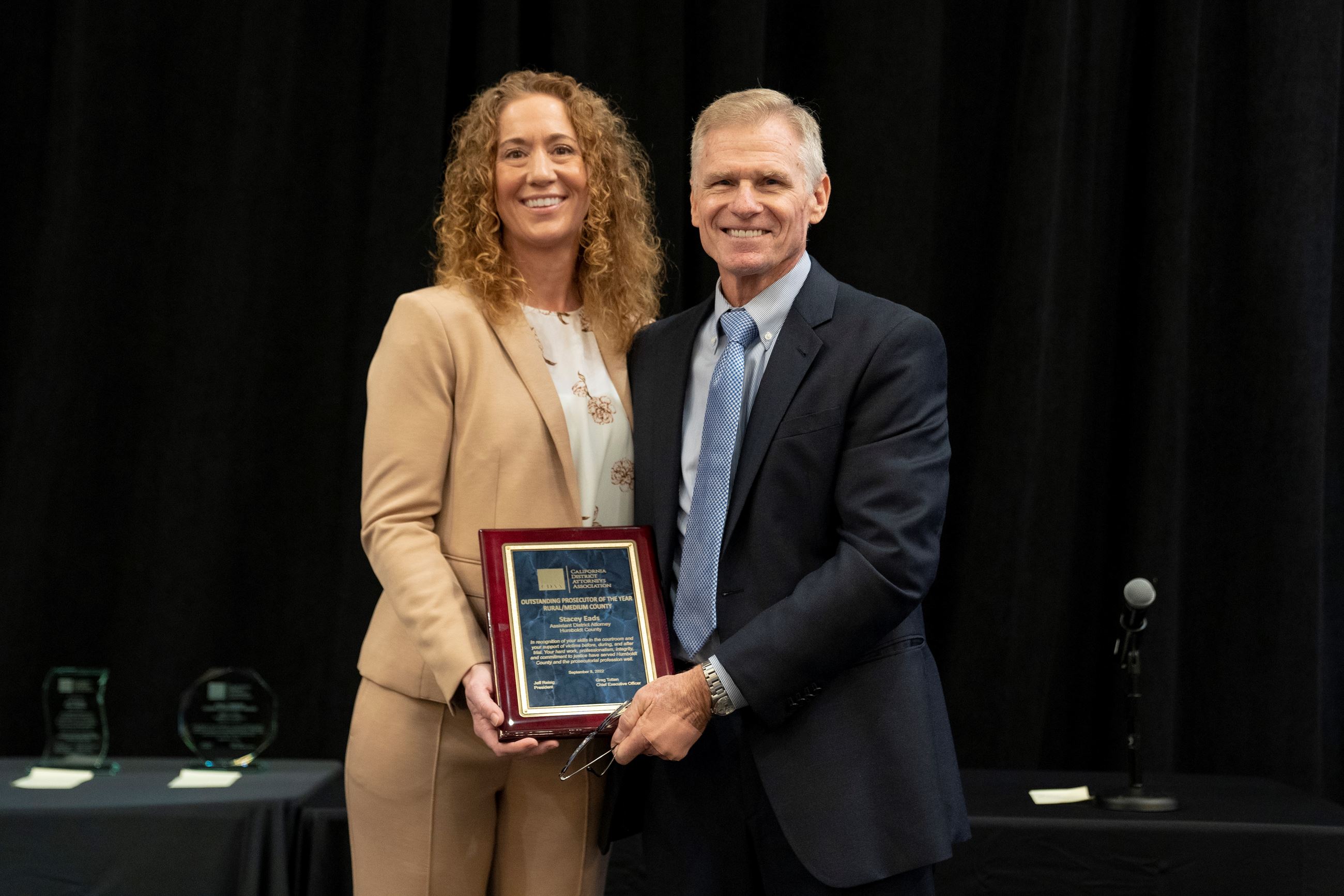 ADA Stacey Eads accepting award from CDAA CEO Greg Totten