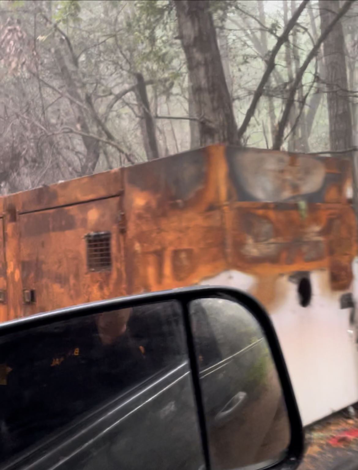 Burnt generator discarded on the roadside