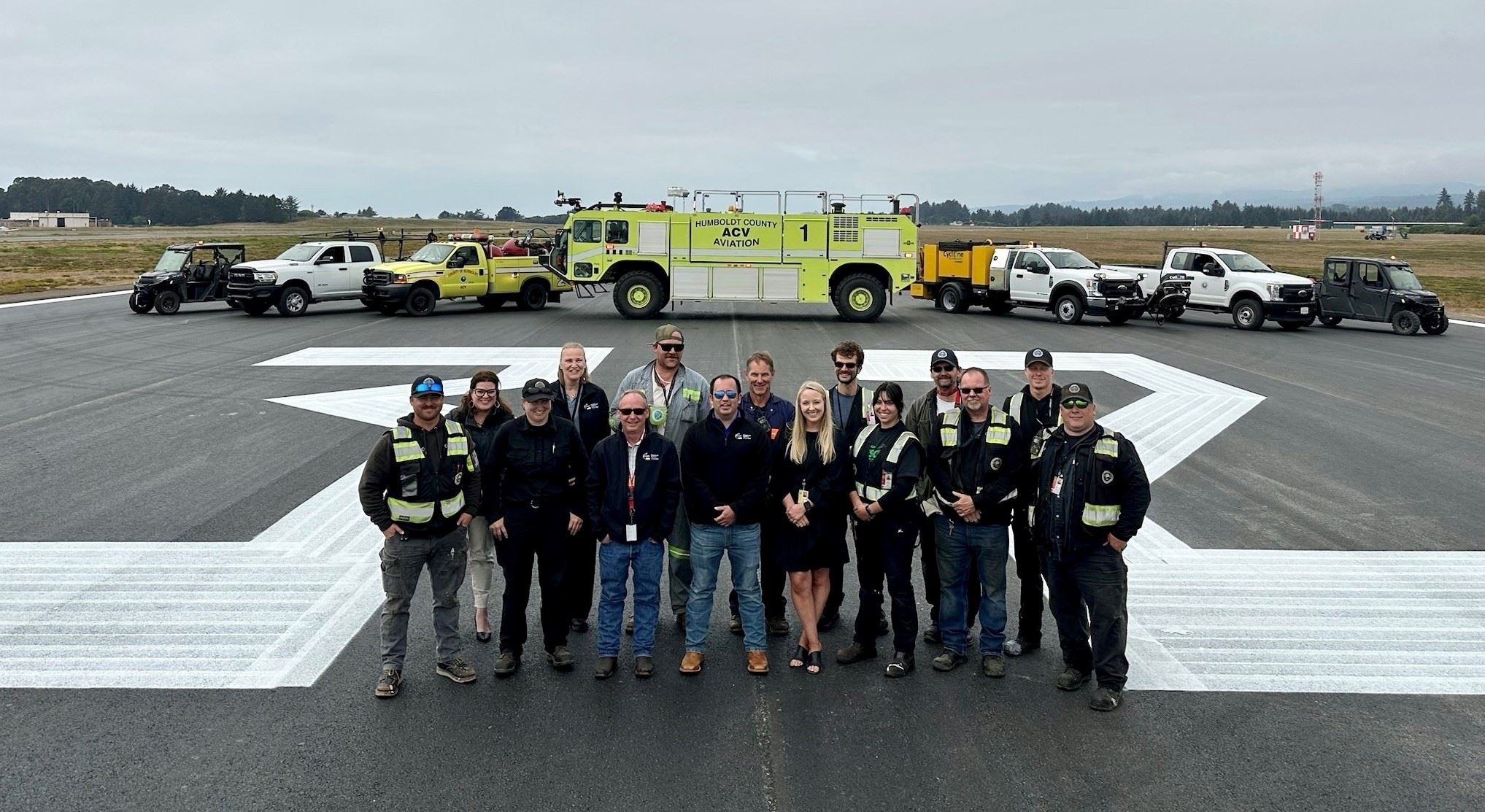 Humboldt County Aviation Department staff gather on the freshly repaved runway at ACV.