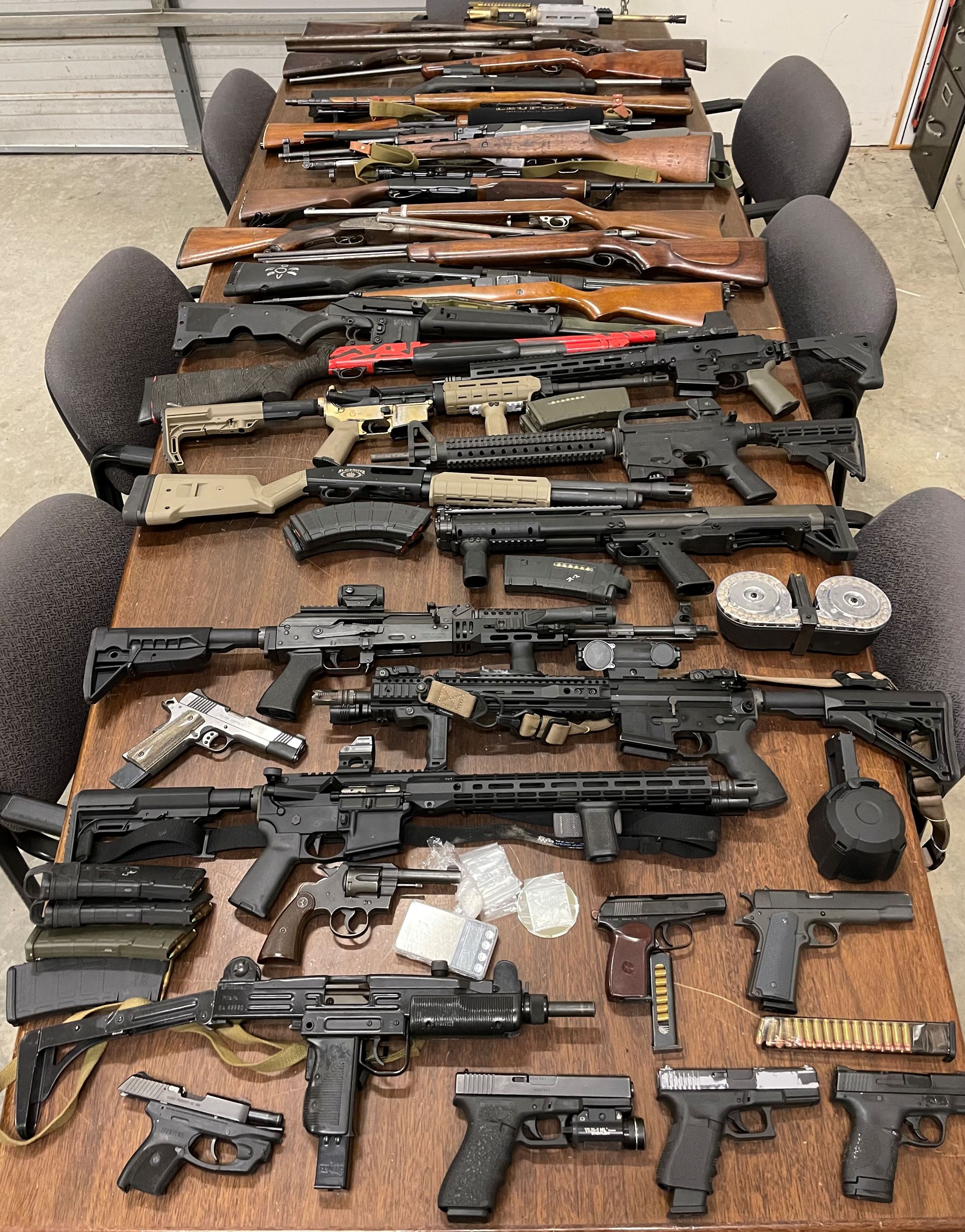 Numerous firearms, narcotics and digital scale