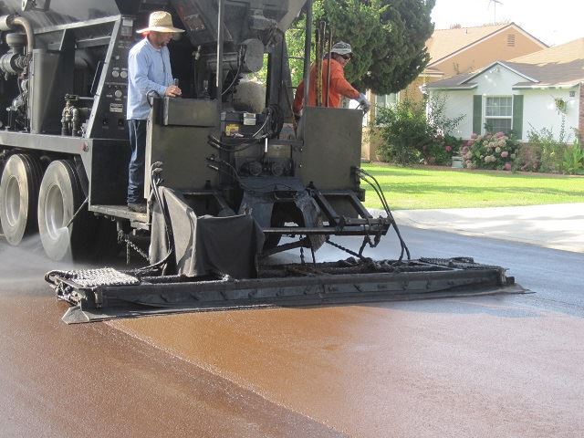 Slurry Seal truck smoothing the application