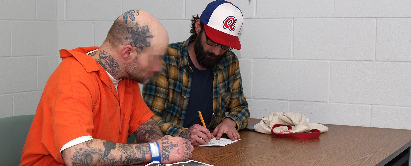 An inmate takes part in the Literacy Project at the correctional facility
