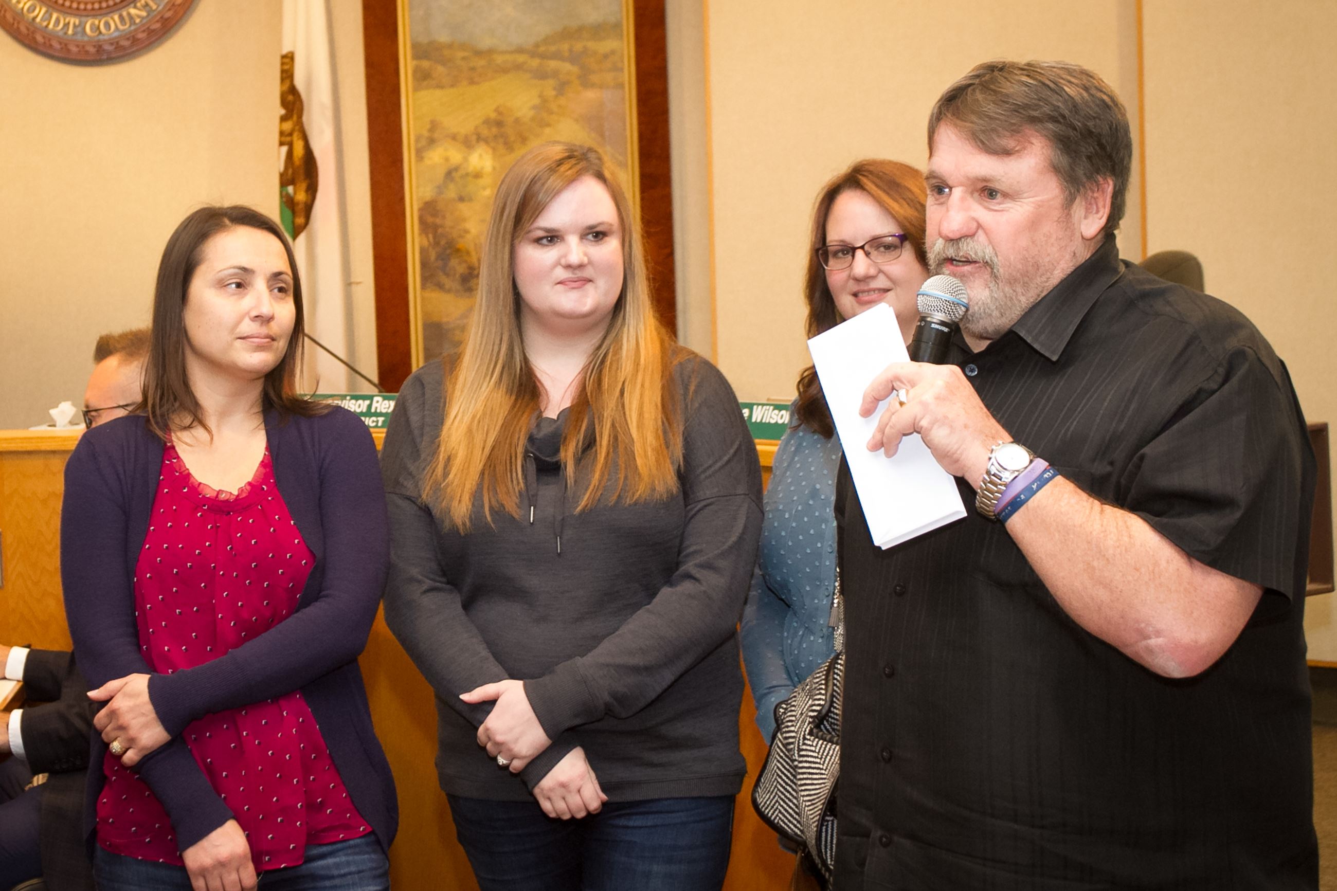 Supervisor Bohn presenting members of Families Advocating Autism Now (FAAN) with a check from RCRC