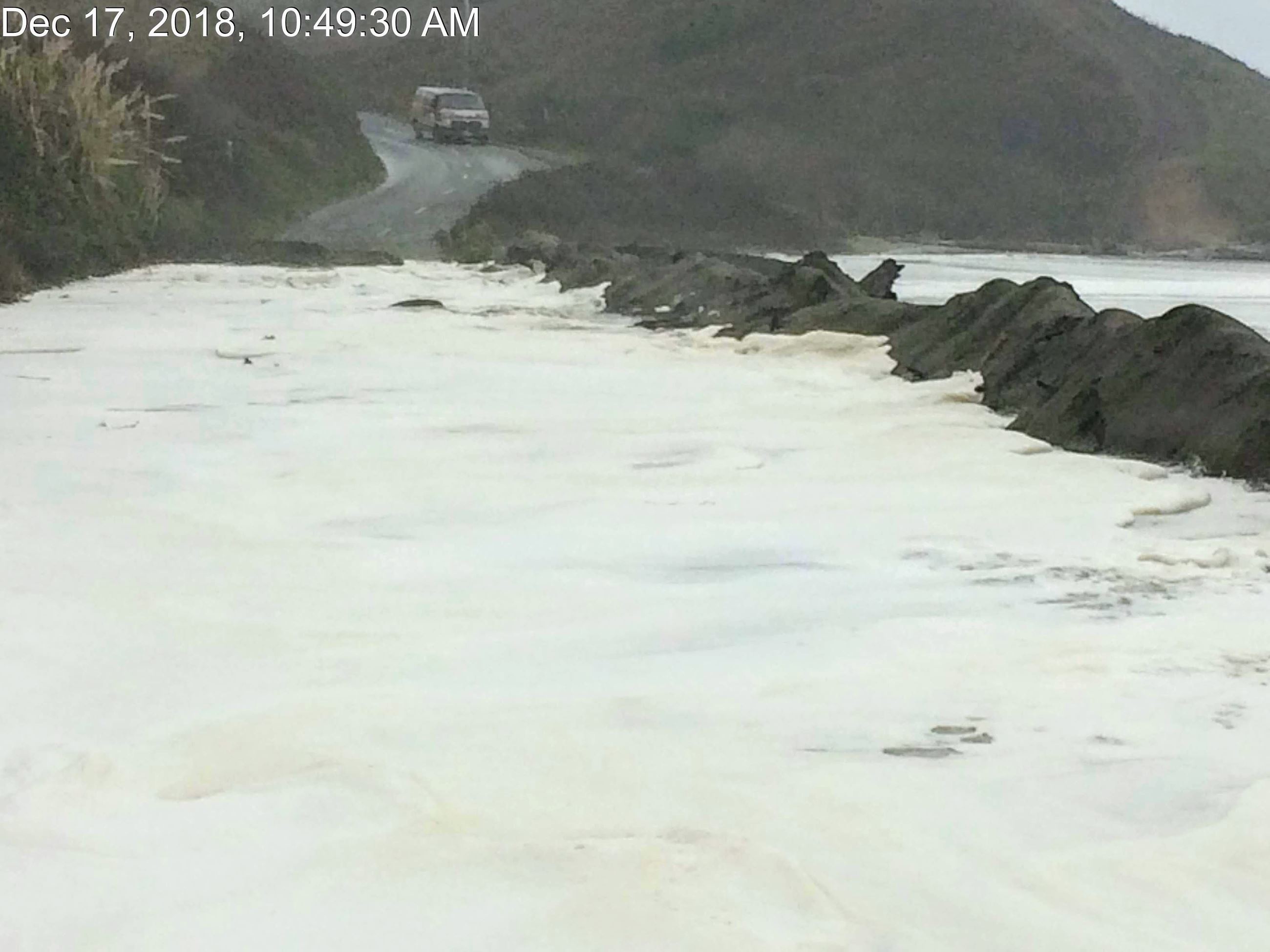 Vehicle approaching flooded roadway at Centerville Beach.