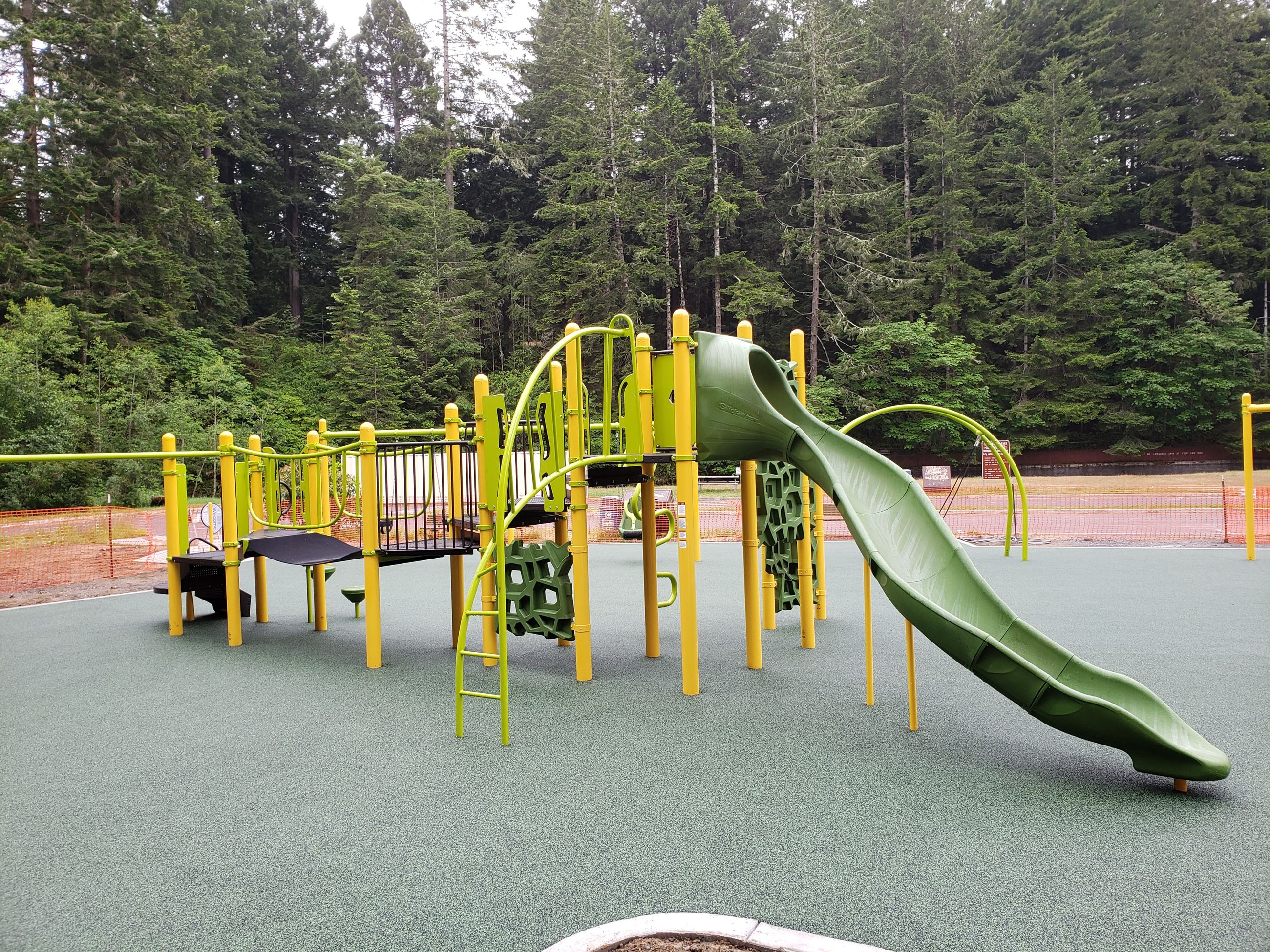 Freshwater Park’s ADA-accessible park is shown with slide and climbing feature.