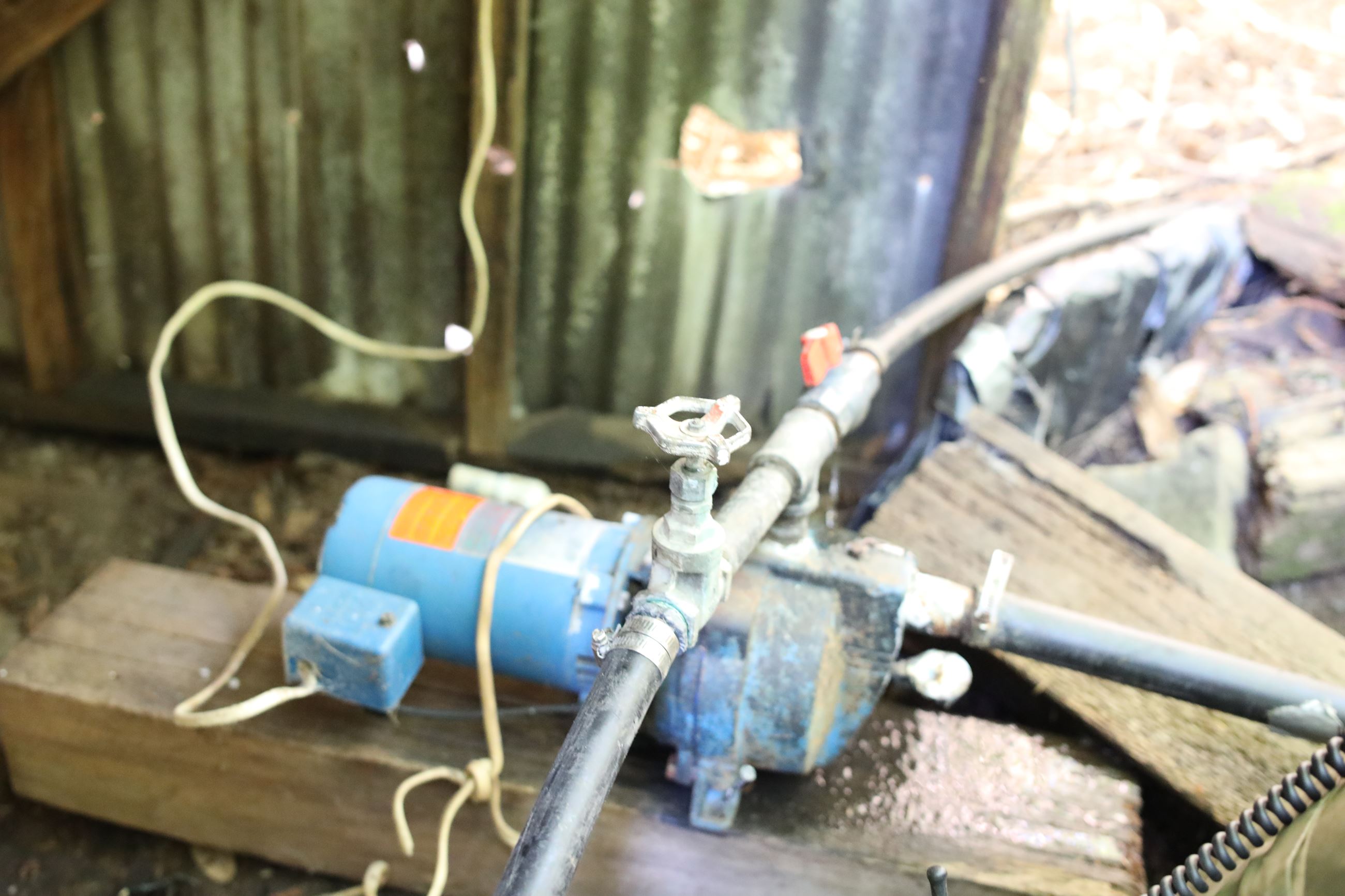 Water pump diverting water from a creek