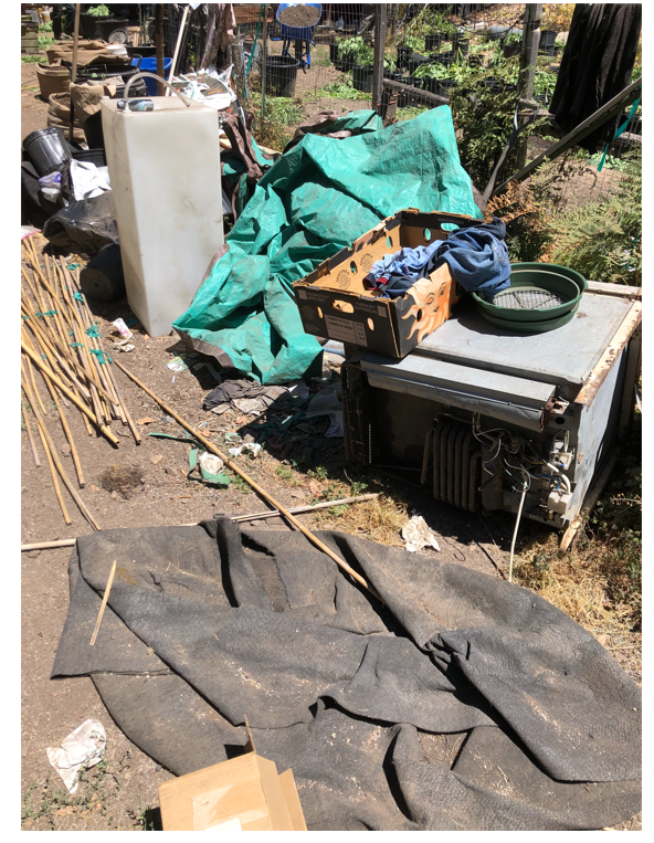 Garbage spread out next to watershed.